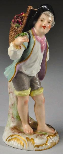 BOY CARRYING BASKET WITH GRAPES FIGURINE.         