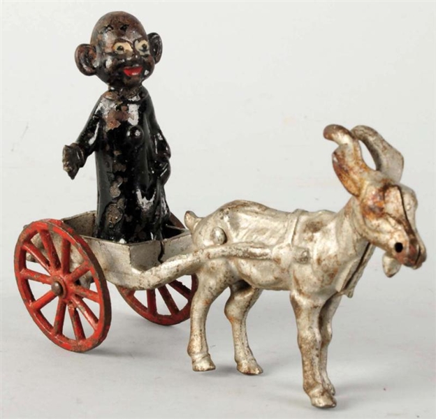 YELLOW KID IN GOAT WAGON TOY.                     