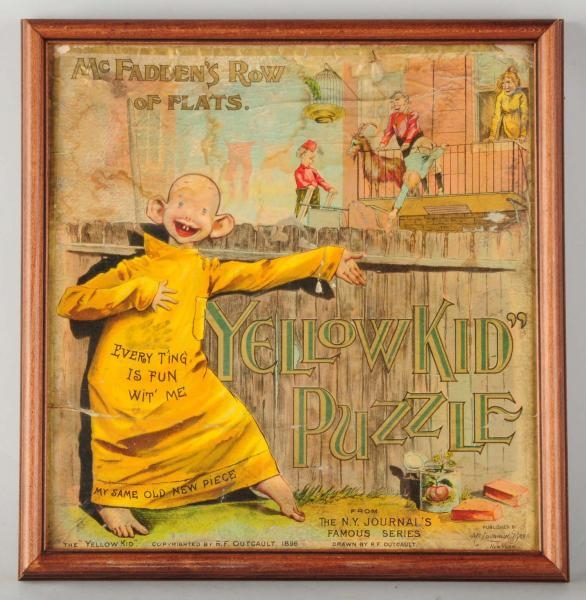 FRAMED YELLOW KID PUZZLE BOX.                     