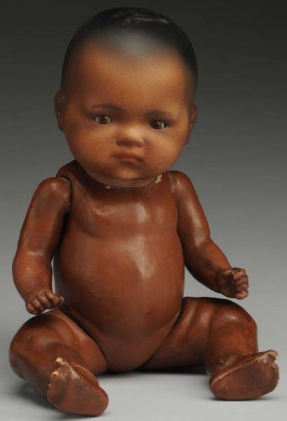 POUTY BLACK GERMAN BISQUE BABY DOLL.              