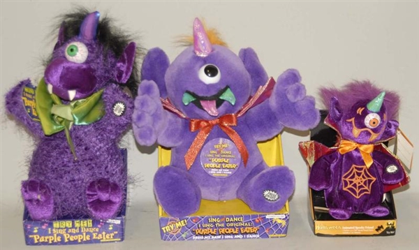LOT OF 3: PURPLE PEOPLE EATER TOYS W/  BOXES.     