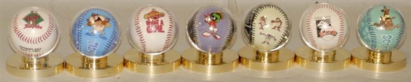 LOT OF 13: ASSORTED CHARACTER BASEBALLS IN CASES. 