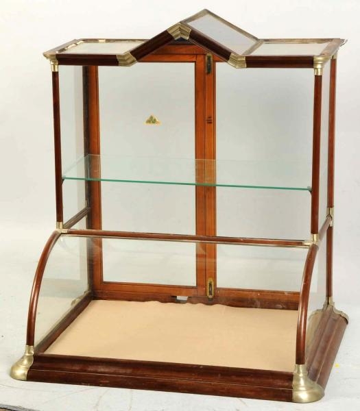 STEEPLE TOP CURVED GLASS DISPLAY CASE.            