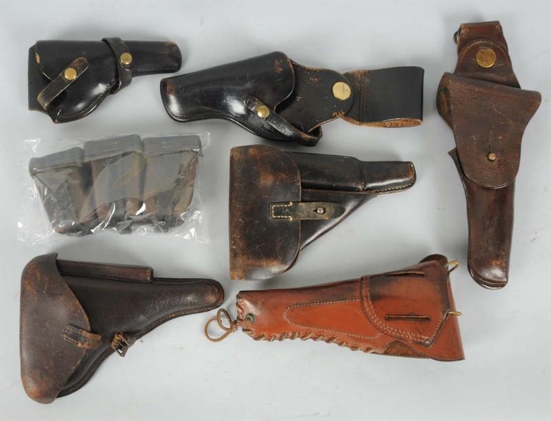 LOT OF 8: ASSORTED LEATHER HOLSTERS & POUCHES.    