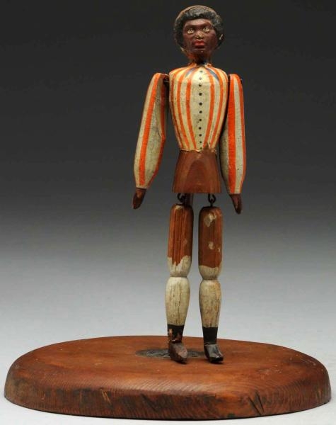 AFRICAN WOODEN JOINTED FIGURE TOY.                