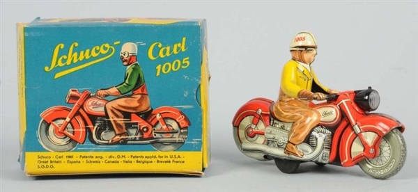 TIN LITHO SCHUCO MOTORCYCLE WIND-UP TOY.          
