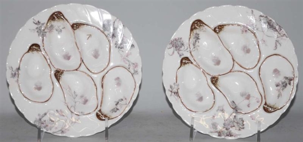 LOT OF 2: ROUND MATCHING OYSTER PLATES.           