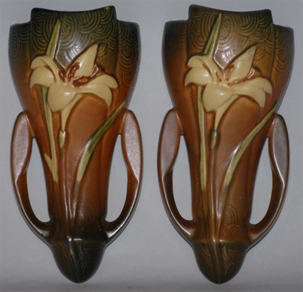PAIR OF BROWN ZEPHYR LILY WALL POCKETS.           