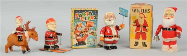 LOT OF 4: SANTA CLAUS WIND-UP TOYS.               