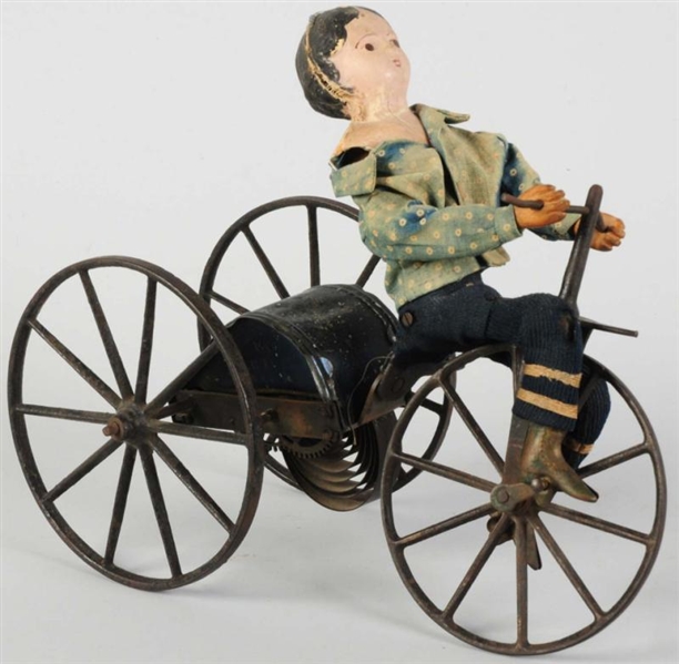 EARLY AMERICAN TIN GEORGE BROWN BICYCLE TOY.      