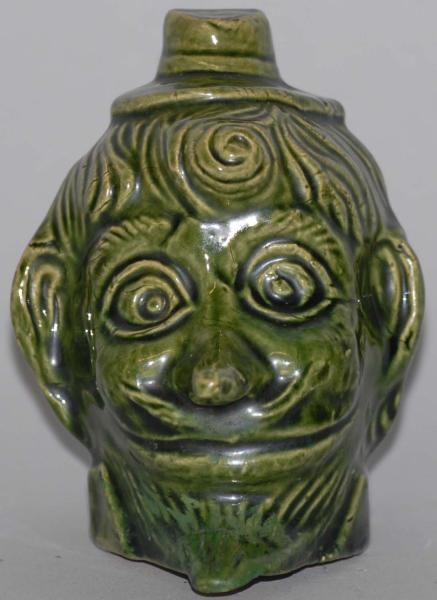 POTTERY MANS HEAD WITH HAT STILL BANK.           