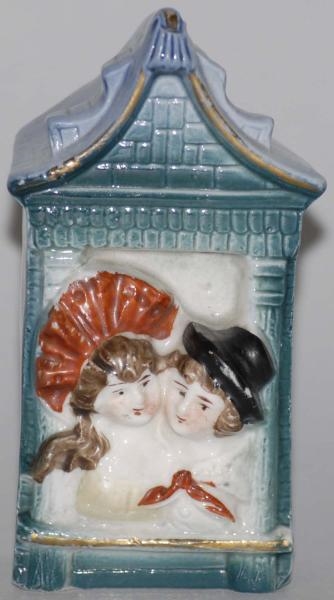 POTTERY COUPLE IN TOWER STILL BANK.               