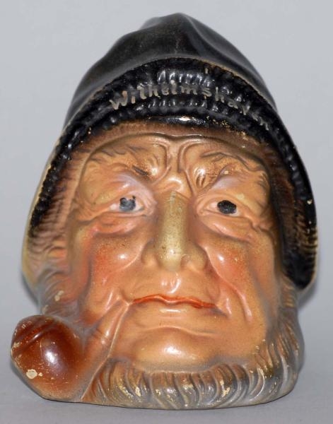 POTTERY SEAMAN WITH PIPE STILL BANK.              