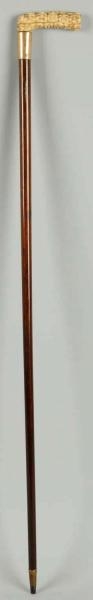 WOODEN CANE WITH IVORY CARVED HANDLE.             