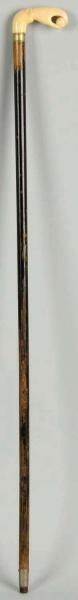 WOODEN CANE WITH IVORY CARVED HANDLE.             