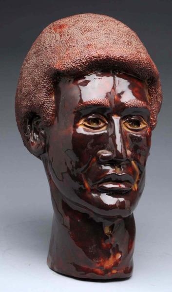 RED POTTERY FIGURAL AFRICAN-AMERICAN HEAD.        