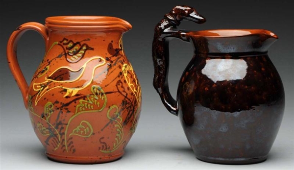 PAIR OF LESTER BREININGER REDWARE PITCHERS.       