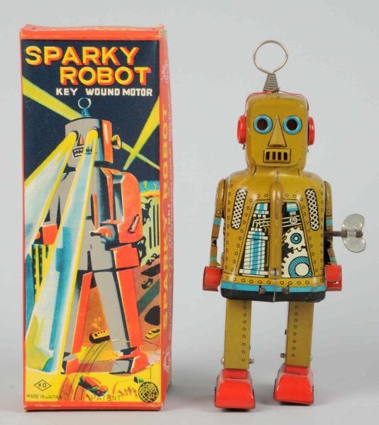 TIN LITHO WIND-UP SPARKY ROBOT IN KHAKI.          