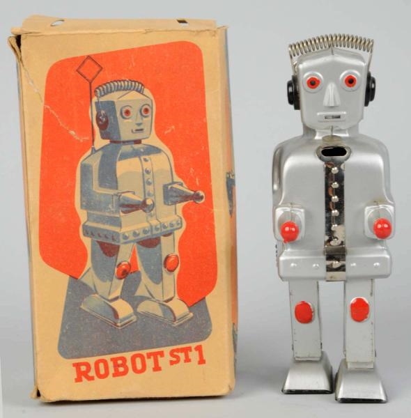PAINTED TIN WIND-UP ROBOT ST1.                    