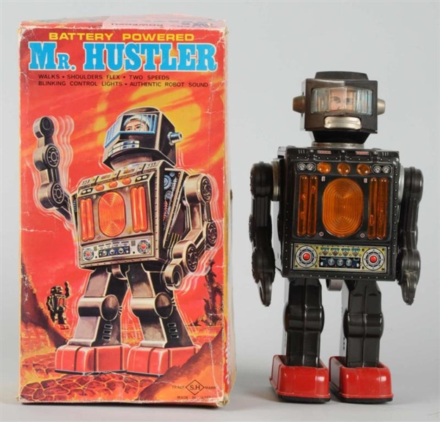 TIN LITHO BATTERY-OPERATED MR. HUSTLER ROBOT.     