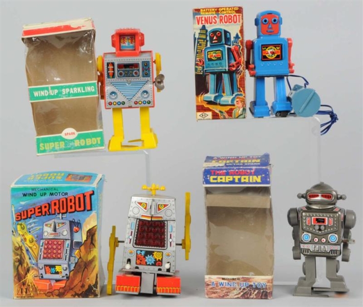 LOT OF 4: ROBOT TOYS.                             
