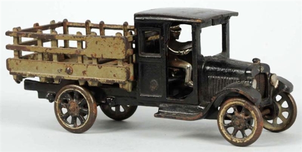 CAST IRON ARCADE STAKE BACK TRUCK TOY.            