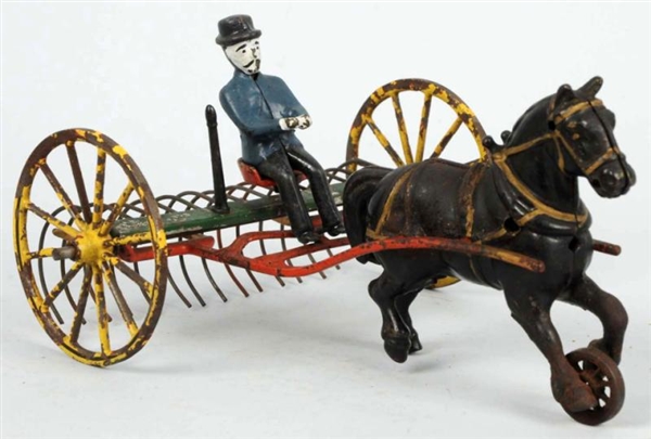EARLY CAST IRON & TIN HORSE-DRAWN PLOW TOY.       