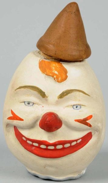 EARLY COMPOSITION CLOWN CANDY CONTAINER.          
