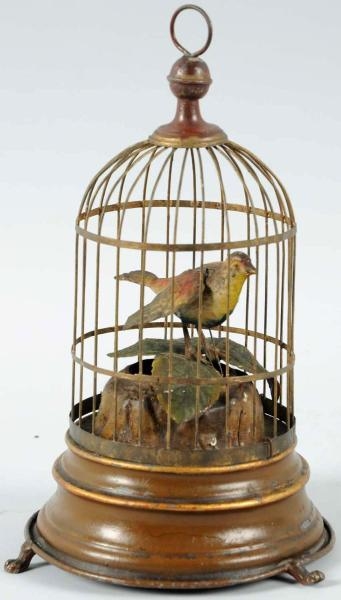 MECHANICAL BIRD IN TIN CAGE.                      