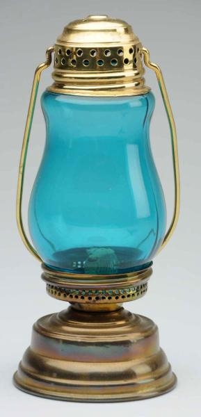 SKATERS LANTERN WITH LIGHT BLUE GLASS.           