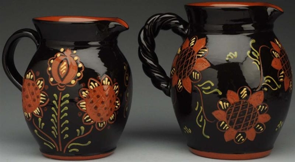PAIR OF LESTER BREININGER WATER PITCHERS.         