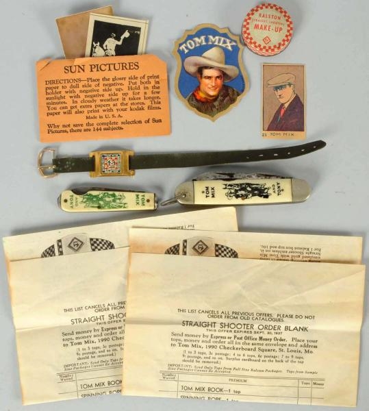 LOT OF ASSORTED TOM MIX ITEMS.                    