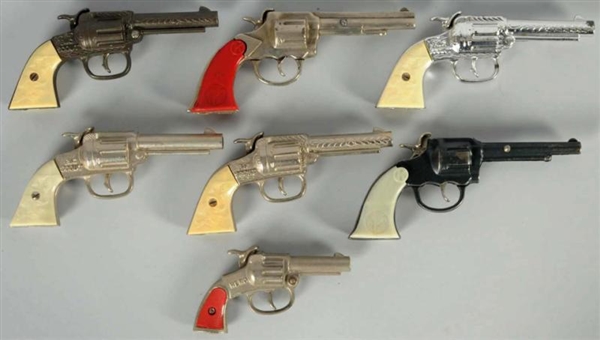 LOT OF 7: BIG SCOUTS & DUMMY CAST IRON CAP GUNS.  