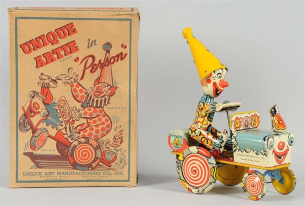 TIN UNIQUE ART CLOWN WHOOPEE CAR WIND-UP TOY.     