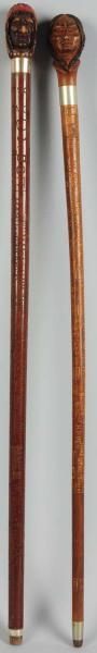 LOT OF 2: HAND-CARVED WALKING STICKS.             