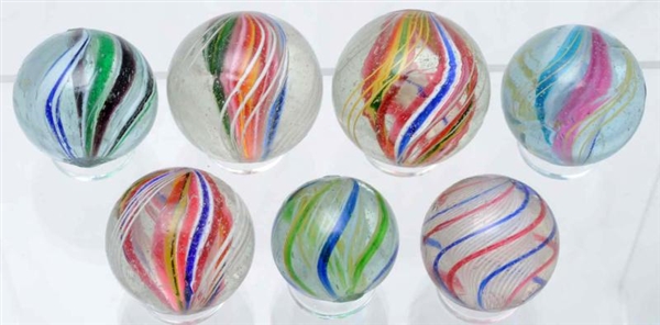 LOT OF 7: SWIRL MARBLES.                          
