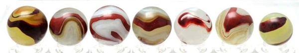 LOT OF 7: AKRO AGATE OXBLOOD MARBLES.             