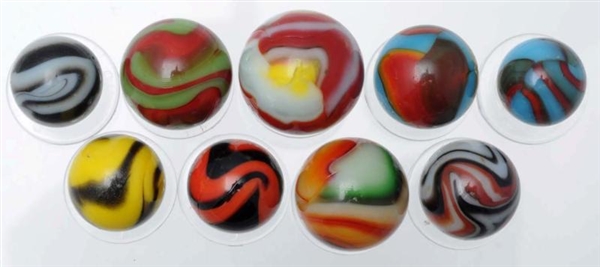 LOT OF 9: ASSORTED PELTIER MARBLES.               