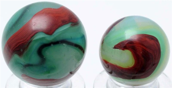 LOT OF 2: AKRO AGATE GREEN OXBLOOD MARBLES.       