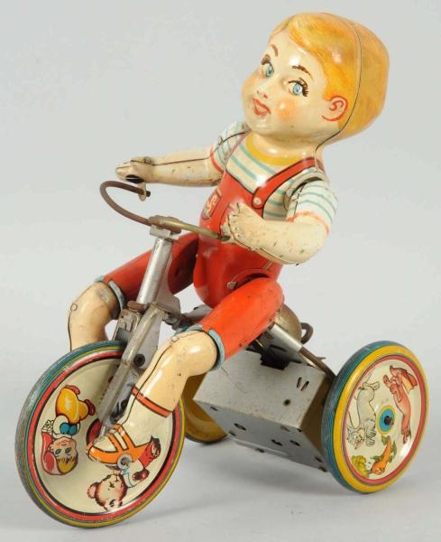 TIN LITHO UNIQUE ART KIDDY CYCLIST WIND-UP TOY.   