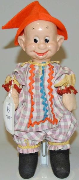 COMPOSITION HEAD DOLL WITH ORANGE HAT.            