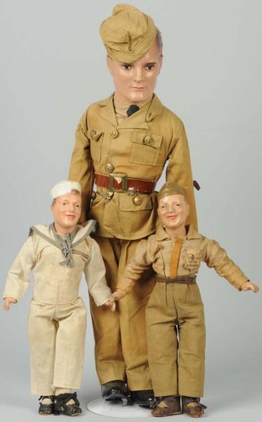 LOT OF 3: MILITARY COMPOSITION MAN DOLLS.         