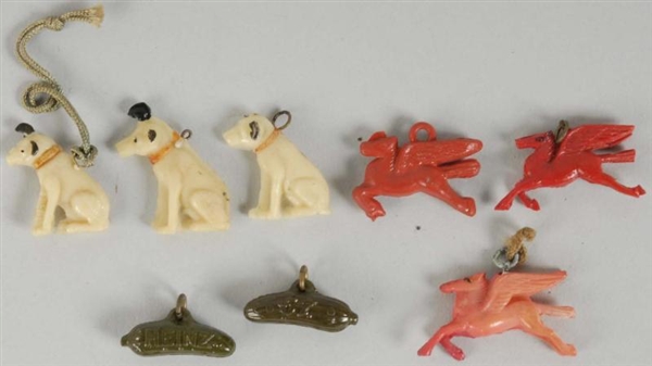 LOT OF 8: ADVERTISING CELLULOID CHARMS.           
