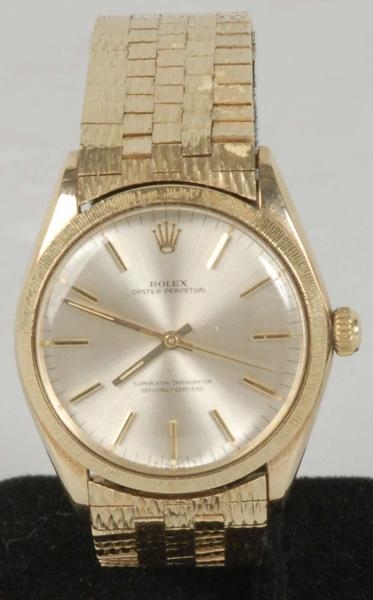 14K YELLOW GOLD MENS ROLEX WATCH.                