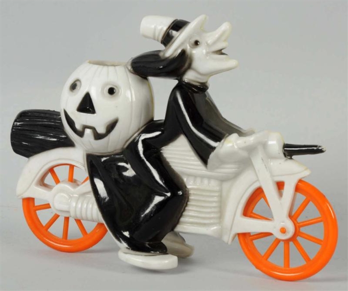PLASTIC HALLOWEEN WITCH ON MOTORCYCLE.            
