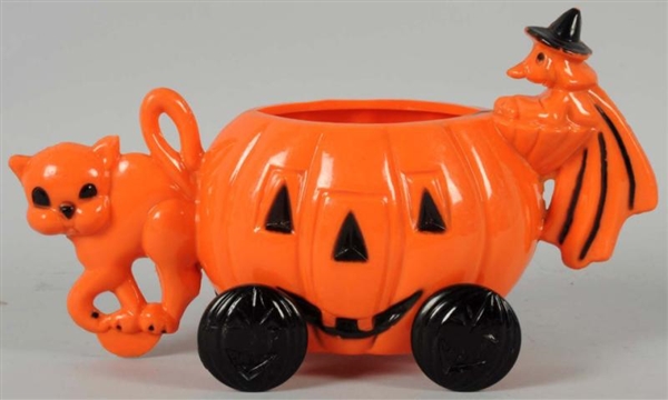 PLASTIC HALLOWEEN CANDY CONTAINER ON WHEELS.      