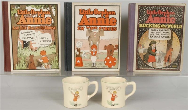 LOT OF LITTLE ORPHAN ANNIE BOOKS AND MUGS.        