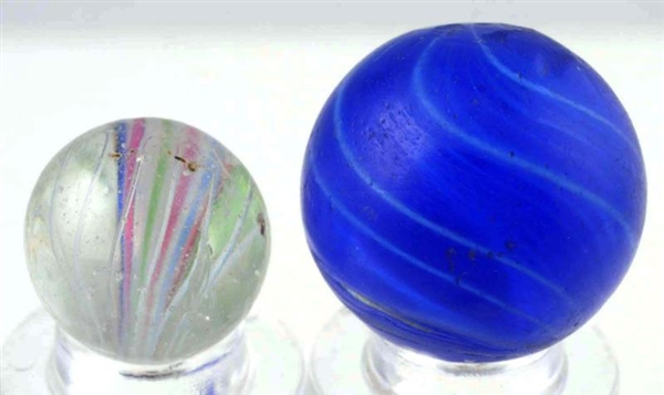 LOT OF 2: END OF CANE SWIRL MARBLES.              