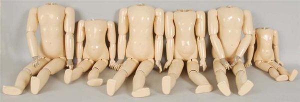 LOT OF 7: REPRODUCTION JOINTED DOLL BODIES.       