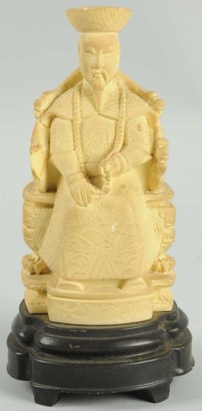 SIMULATED CARVED IVORY ORIENTAL SEATED MAN.       